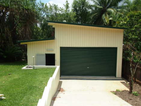 Large shed with slanted roof.